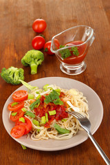 Tasty spaghetti with sauce and vegetables