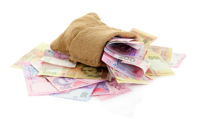 Burlap bag with Ukrainian money, isolated on white