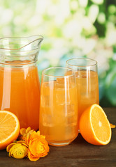 Glasses and pitcher of orange juice