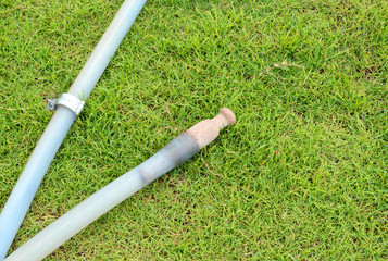 rubber pipe on grass field
