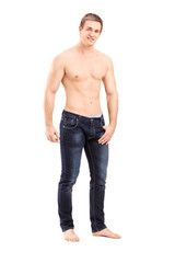 Fototapeta premium Full length portrait of a shirtless handsome guy looking at came