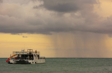 Obraz premium Rainstorm in a sea at sunrise