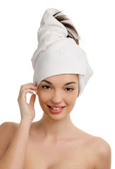 Woman with wrapped towel on the head.Spa beauty treatment.