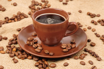 Composition with brown cup of coffee