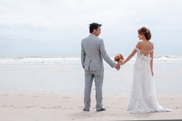 groom and bride embrace