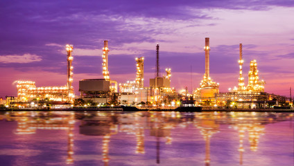 Fototapeta premium Petroleum oil refinery factory over sunrise