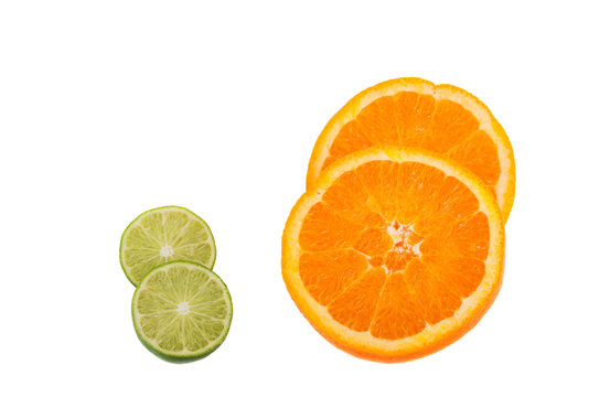 lime and orange cut in half isolated on white background