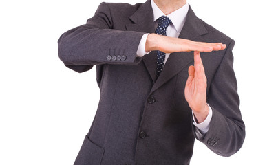 Businessman showing time out sign with hands.