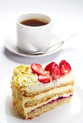 Strawberry cake and cup of coffee