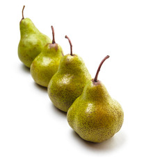 Four pears in a row on white