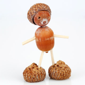 Figure made of acorns and matches