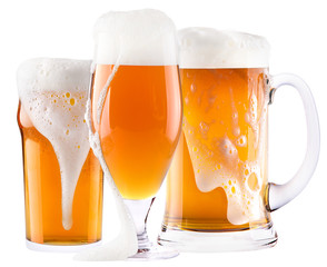 Frosty fresh beer collection with foam isolated