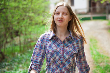 Beautiful young woman walking outdoors