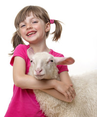a happy little girl with a sheep © Vera Kuttelvaserova