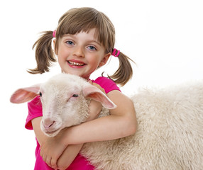 happy little girl with sheep
