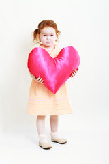 little girl with huge bright red heart