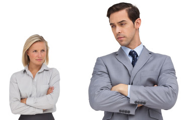 Young business people standing together showing rivalry