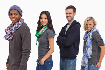 Fototapeta premium Stylish young people in a row smiling