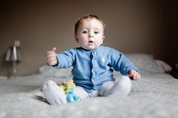 baby on a bed playing