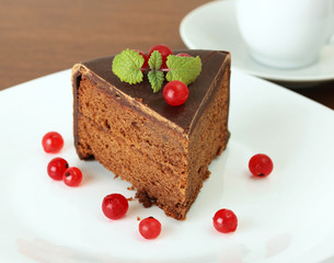 delicious chocolate cake with  red currant and lemon balm
