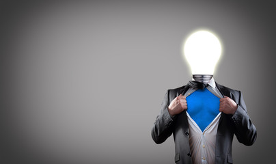 businessman super hero with light bulb head have got an idea