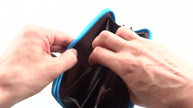 person seeking money in blue wallet