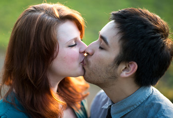 Amorous young couple kissing