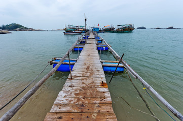 Old pontoon beside the sea,the bridge towards faraway
