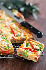 Pie with salmon, red pepper and broccoli, selective focus