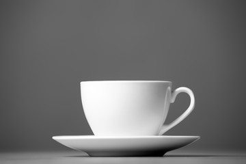 White mug on a gray background.