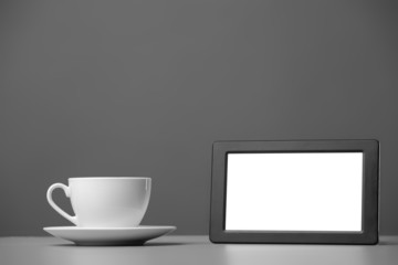 White mug and tablet computer