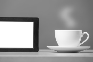 White mug and tablet computer