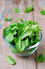Spinach in a glass bowl on the table
