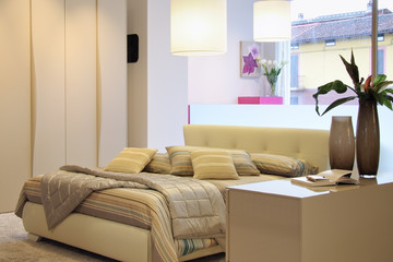 Modern bedroom with wide window