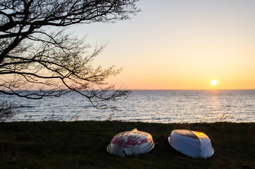 Rowing boats at sunset