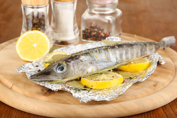Fish in foil with herbs and lemon