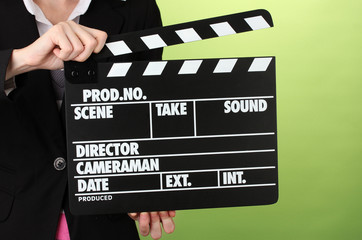 Movie production clapper board on color background