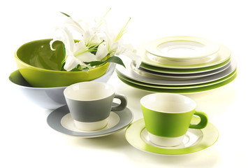 Empty bowls, plates and cups isolated on white