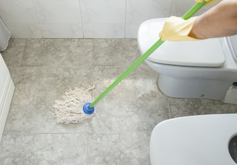 scrubbing the bathroom floor