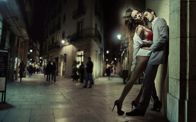 Sensual loving couple kissing in the dead of the night