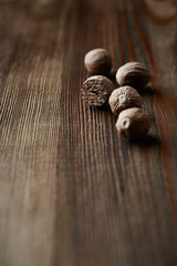 Nutmeg on wooden surface