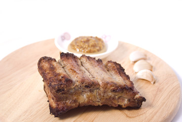 BBQ Ribs on wooden plate