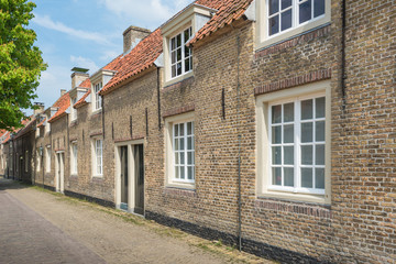 Fototapeta na wymiar Small historic houses in an old Dutch village