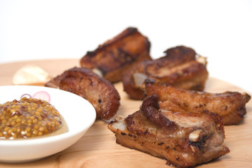 BBQ Ribs on wooden plate