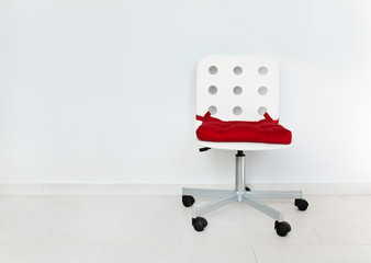 White chair against wall