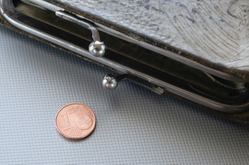 A black wallet and one cent of euro, to symbolize poverty, bankrupt