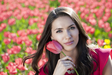 Beautiful young woman with tulips