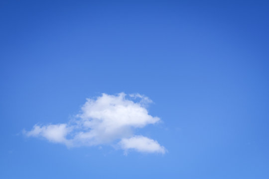 white fluffy cloud blue sky