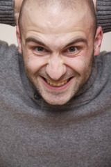 fashion portrait of handsome young man in a sweater