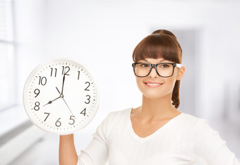 businesswoman with wall clock
